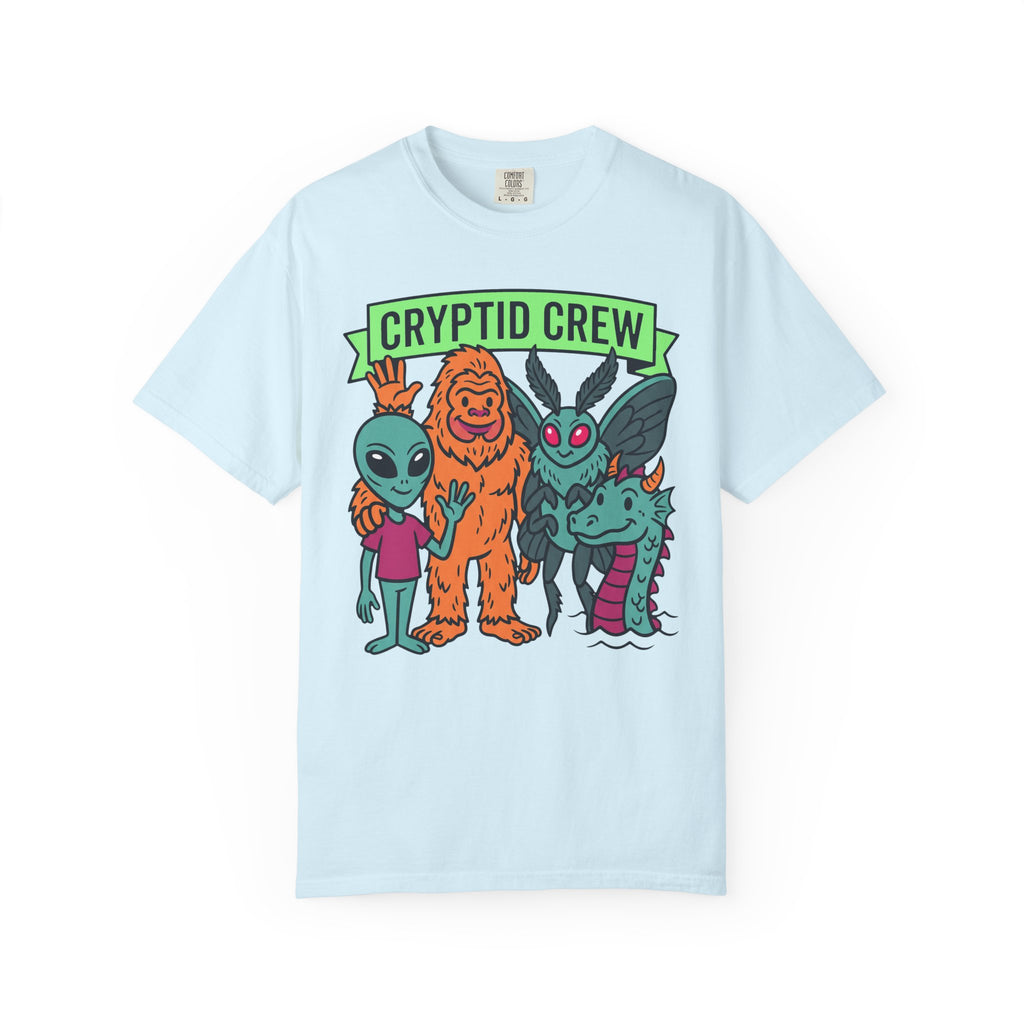 Light blue crew neck t-shirt with “CRYPTID CREW” cartoon cryptid group graphic