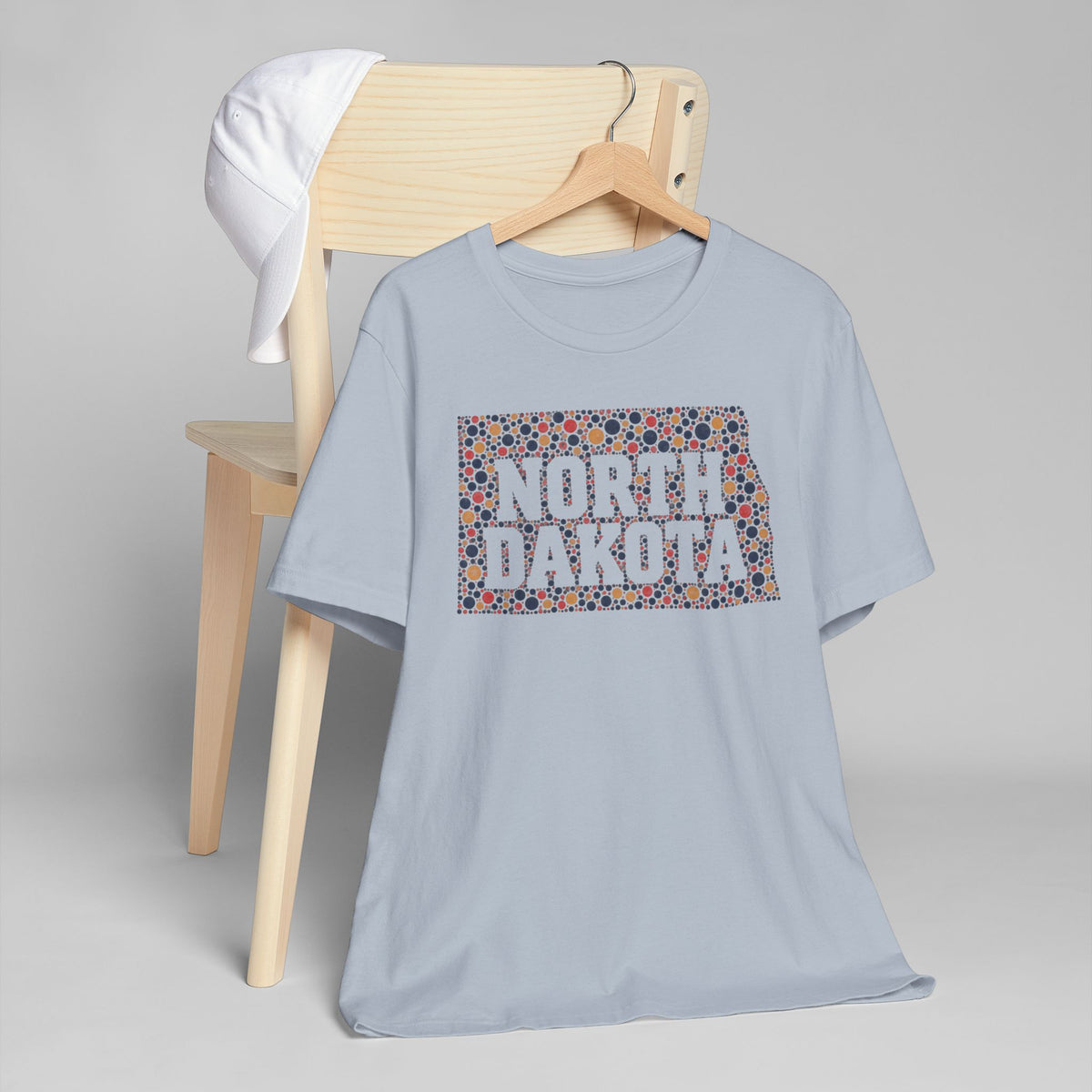 Light blue crew-neck short-sleeve T-shirt with North Dakota floral map graphic