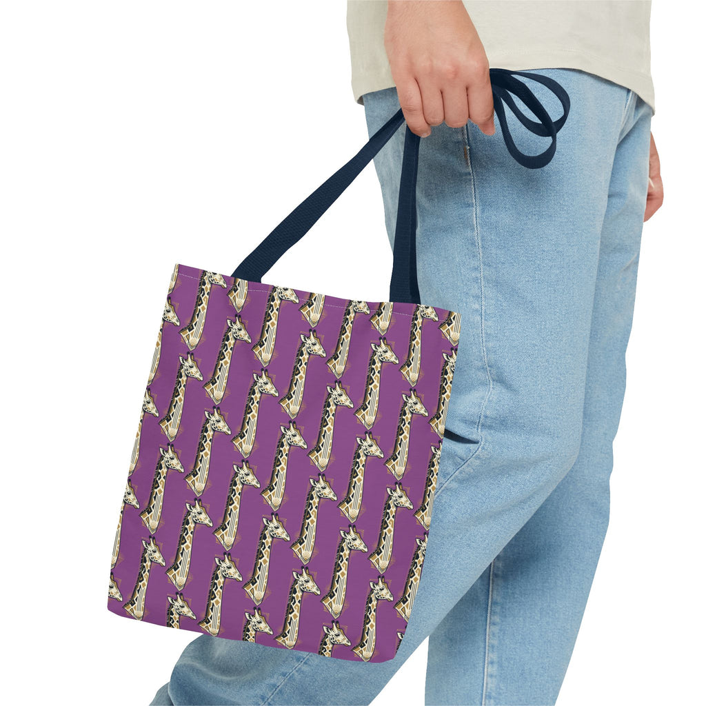Purple tote bag with saxophone pattern and navy handles, held by person.