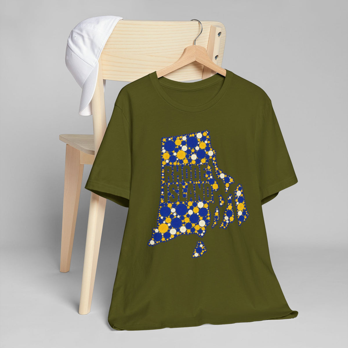 Olive green T-shirt with blue and yellow dotted Rhode Island graphic on chest