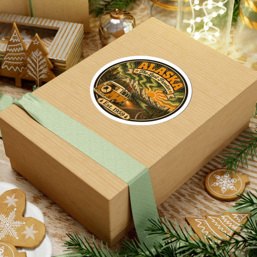 Round Alaska vintage sticker on a gift box, showing a yellow camper van and Est. 1959