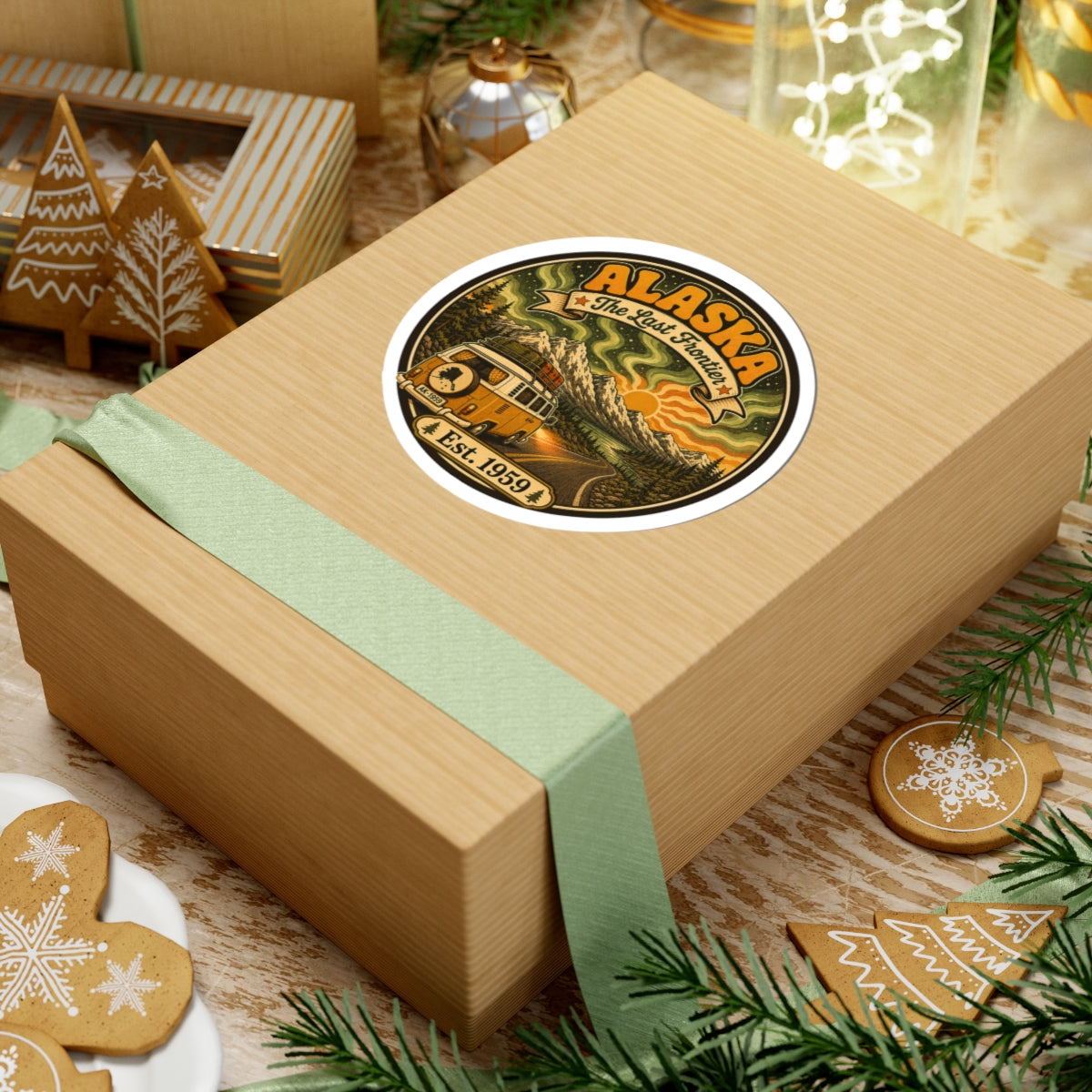 Round Alaska vintage sticker on a gift box, showing a yellow camper van and Est. 1959