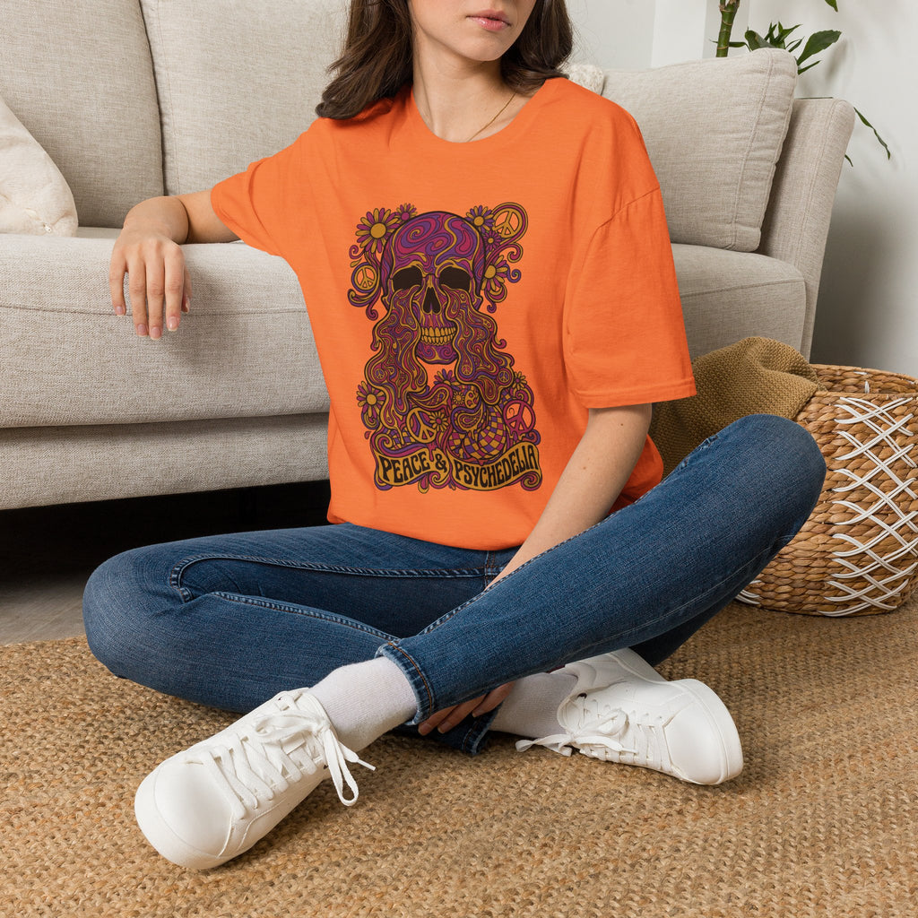 Orange skull graphic t-shirt with colorful psychedelic floral skull and Peace & Psychedelia text