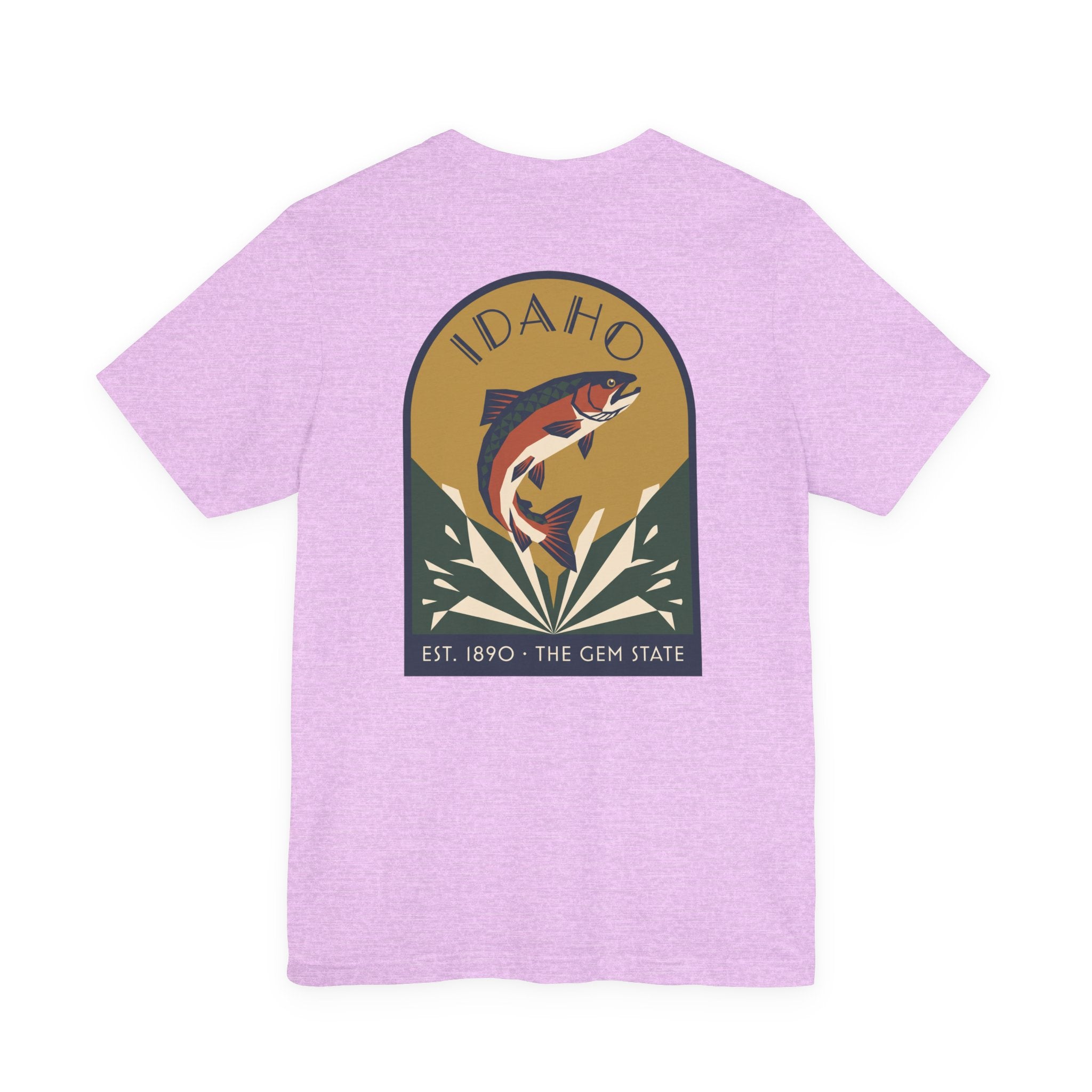 Lavender crewneck t-shirt with circular Idaho trout badge graphic and "EST. 1890 • THE GEM STATE" text.