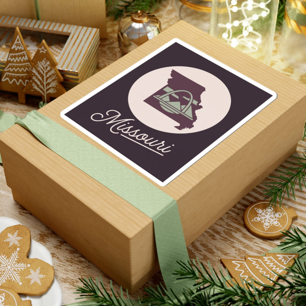 Missouri sticker decal on wrapped gift, dark purple square with circular emblem and Missouri text