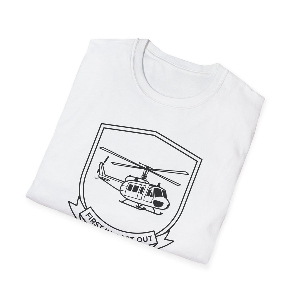 White T-shirt with large black helicopter shield graphic and ribbon text “First In, Last Out”.
