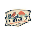 North Dakota kiss-cut vinyl sticker with “North Dakota” headline, bird, and red prairie sky circle