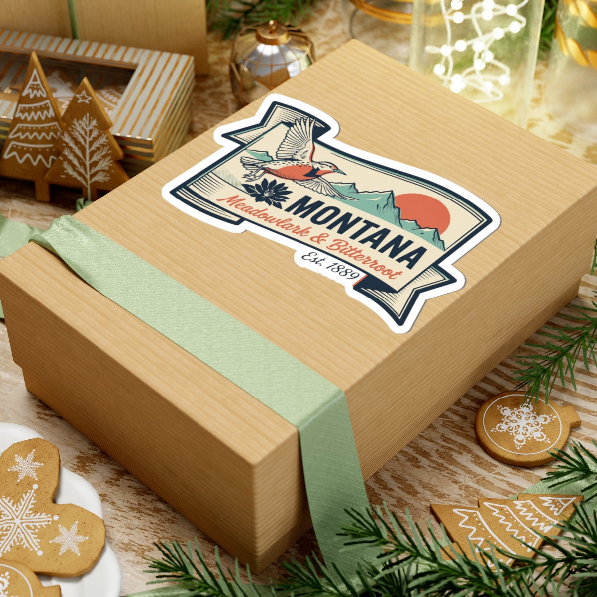 Montana state badge vinyl sticker on wrapped gift, showing bird, mountains, and banner