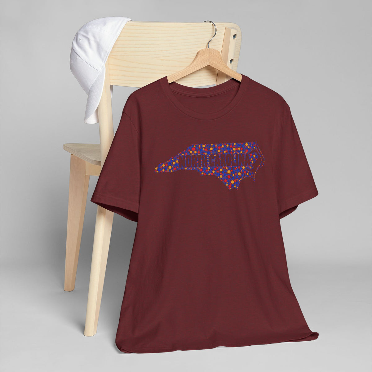 Burgundy crewneck short-sleeve T-shirt with colorful North Carolina map graphic