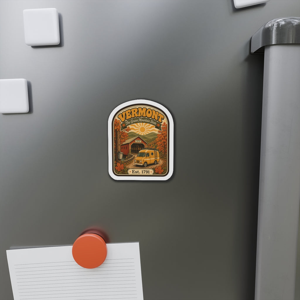 Die-cut Vermont covered bridge magnet on a refrigerator, showing yellow van and Est. 1791