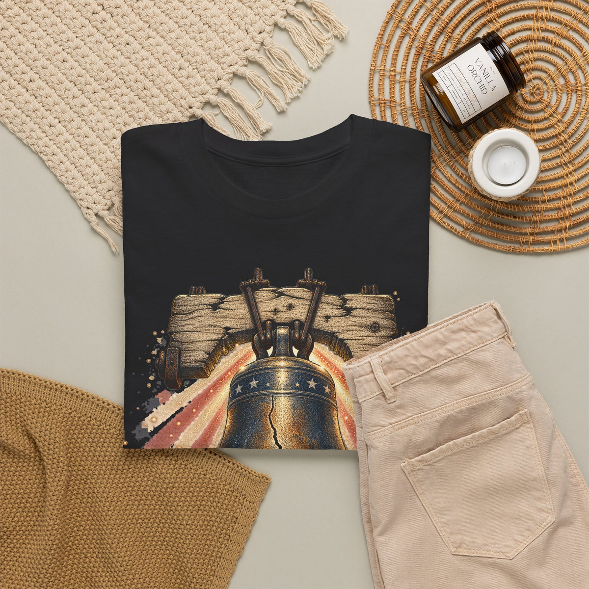 Black crewneck graphic T-shirt with bell and fireworks print on the front.
