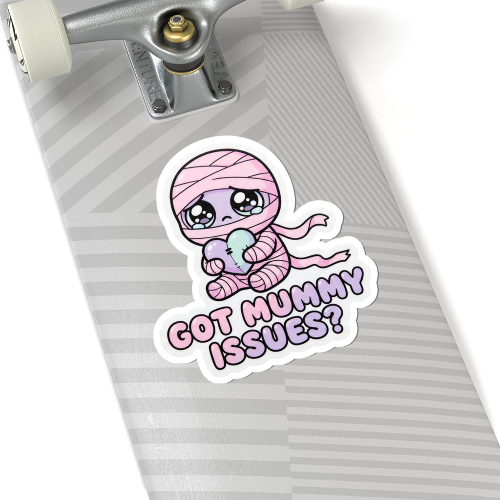 Baby mummy holding heart sticker with pink hood, “GOT MUMMY ISSUES?” text