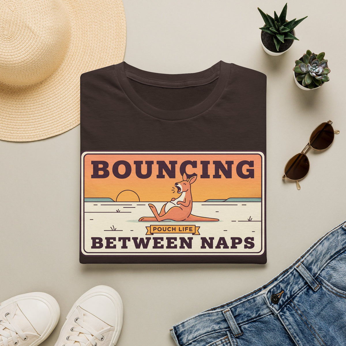Dark brown T-shirt with kangaroo “Bouncing Between Naps” graphic