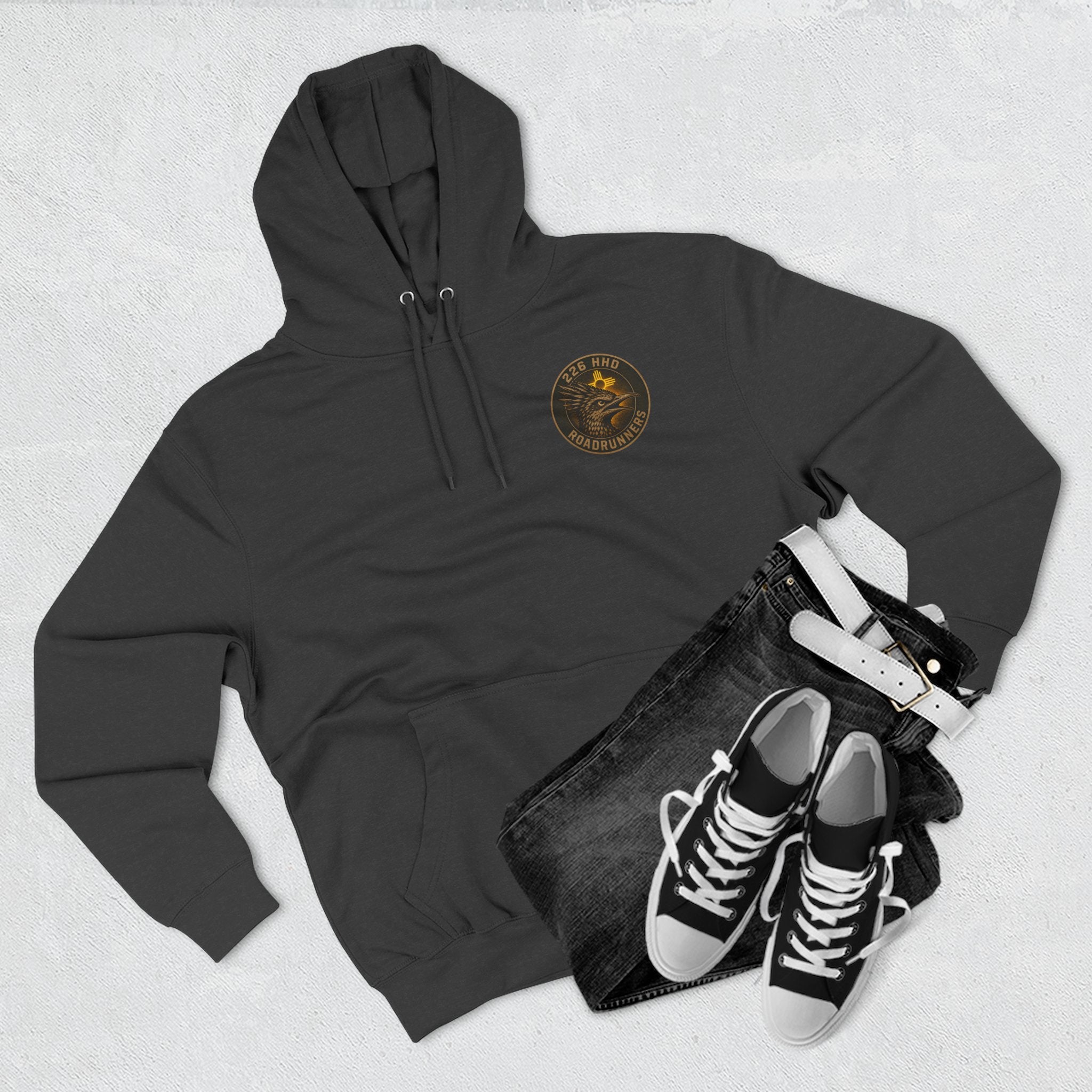 Black pullover hoodie with hood, drawstrings, and small chest logo graphic