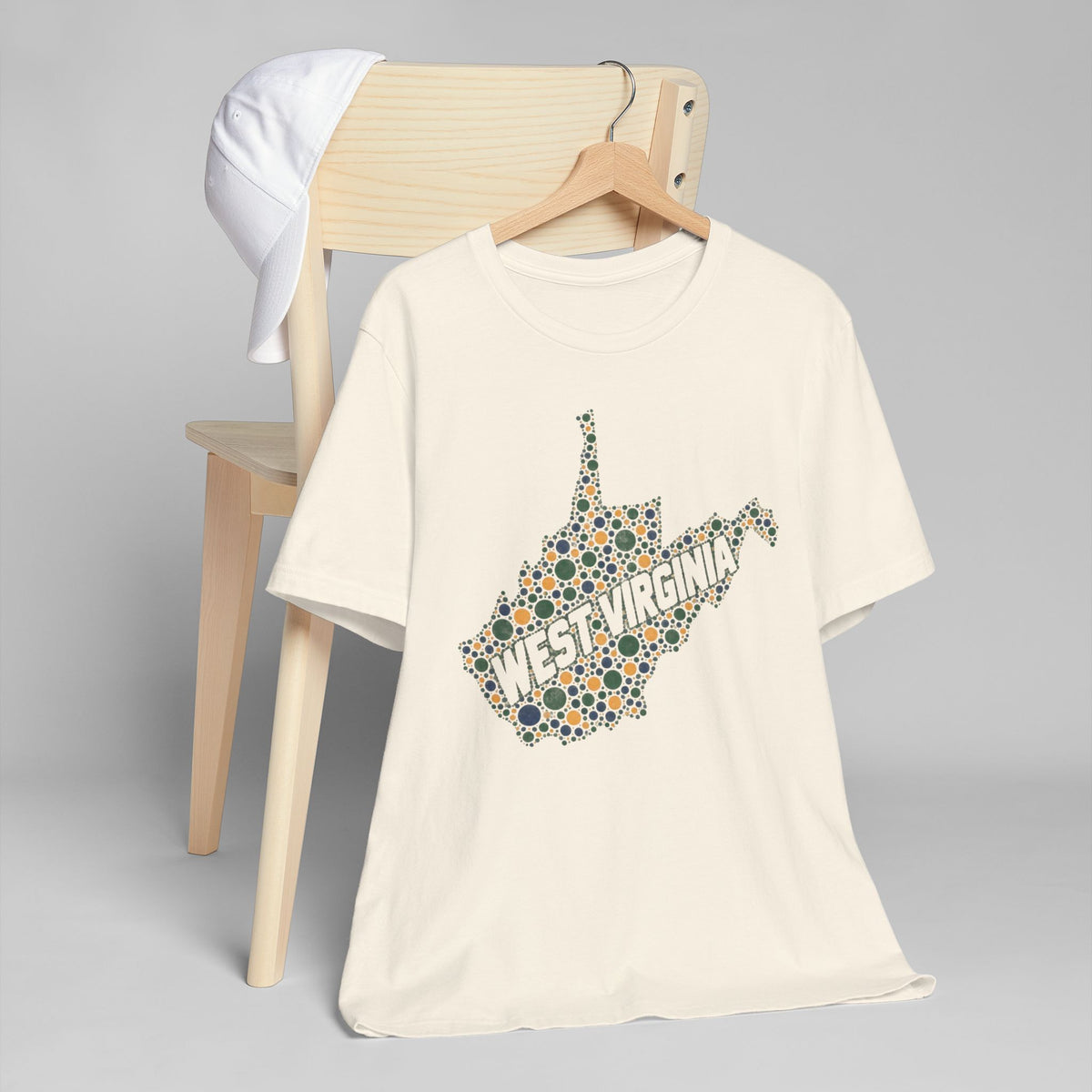 Cream T-shirt with West Virginia floral map outline graphic in multicolor dots