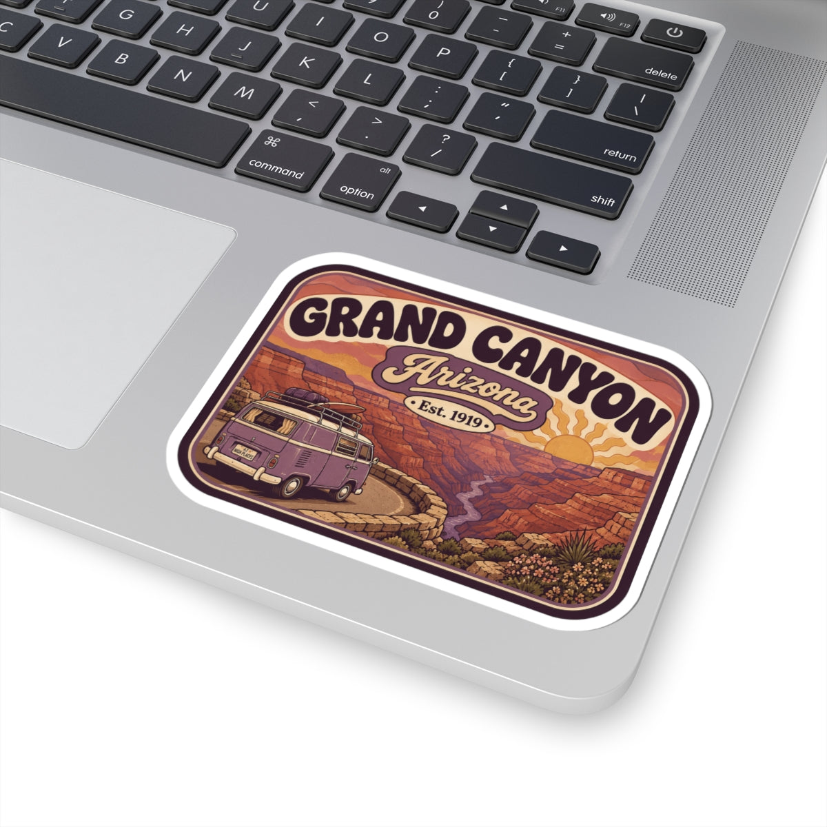 Grand Canyon Arizona sticker on laptop, rounded white border with purple camper van