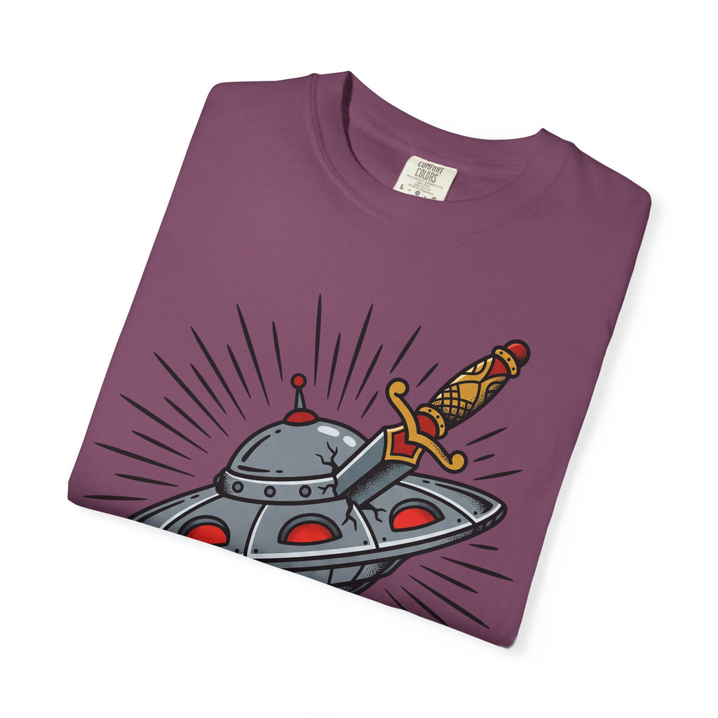Purple T-shirt folded flat, front UFO dagger illustration with rays