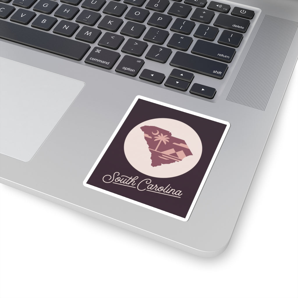 South Carolina sticker placed on a laptop lid with palm tree circular emblem