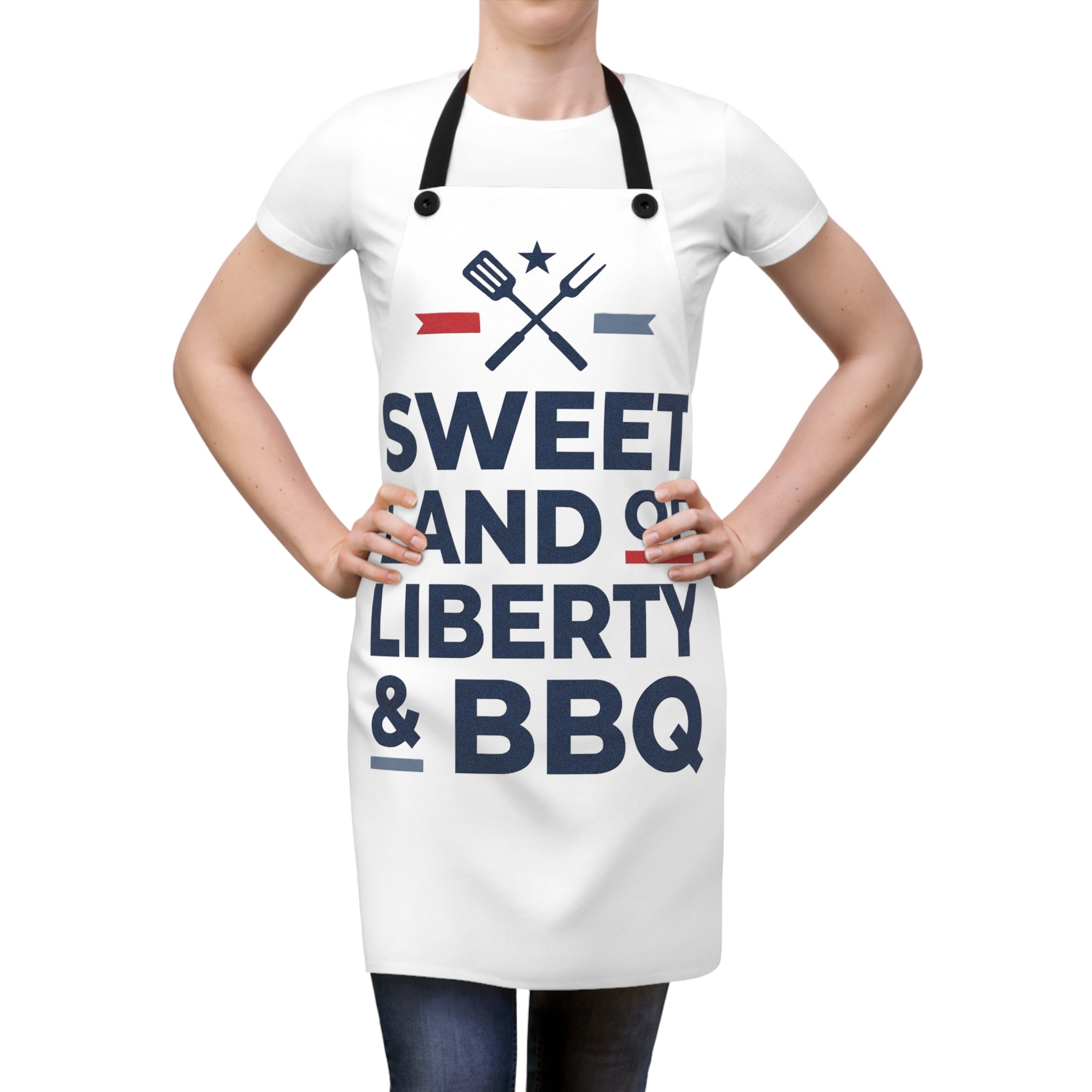 BBQ apron worn over a white T-shirt, black straps and “Sweet Land of Liberty & BBQ” print