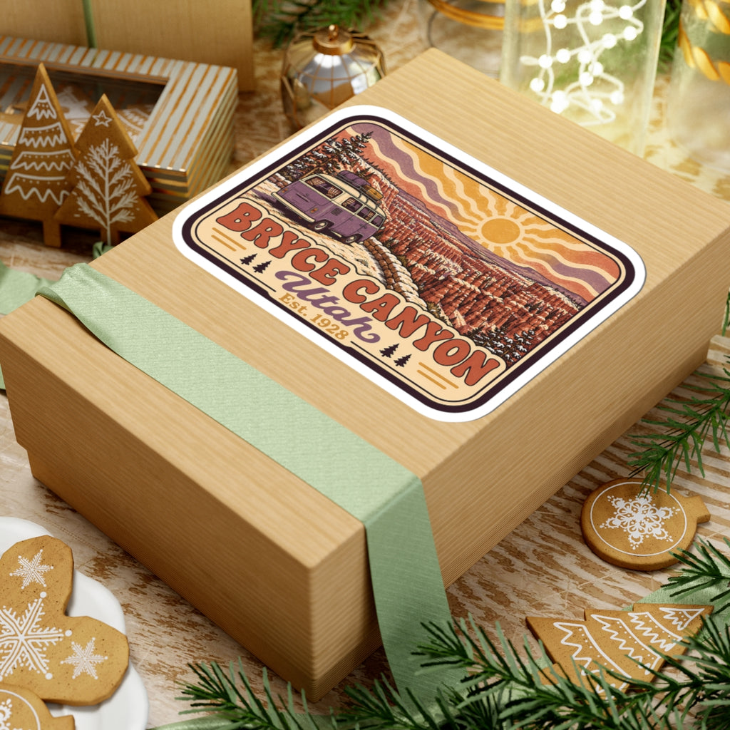 Kiss-cut Bryce Canyon Utah sticker on wrapped gift, showing camper van, sun, and canyon