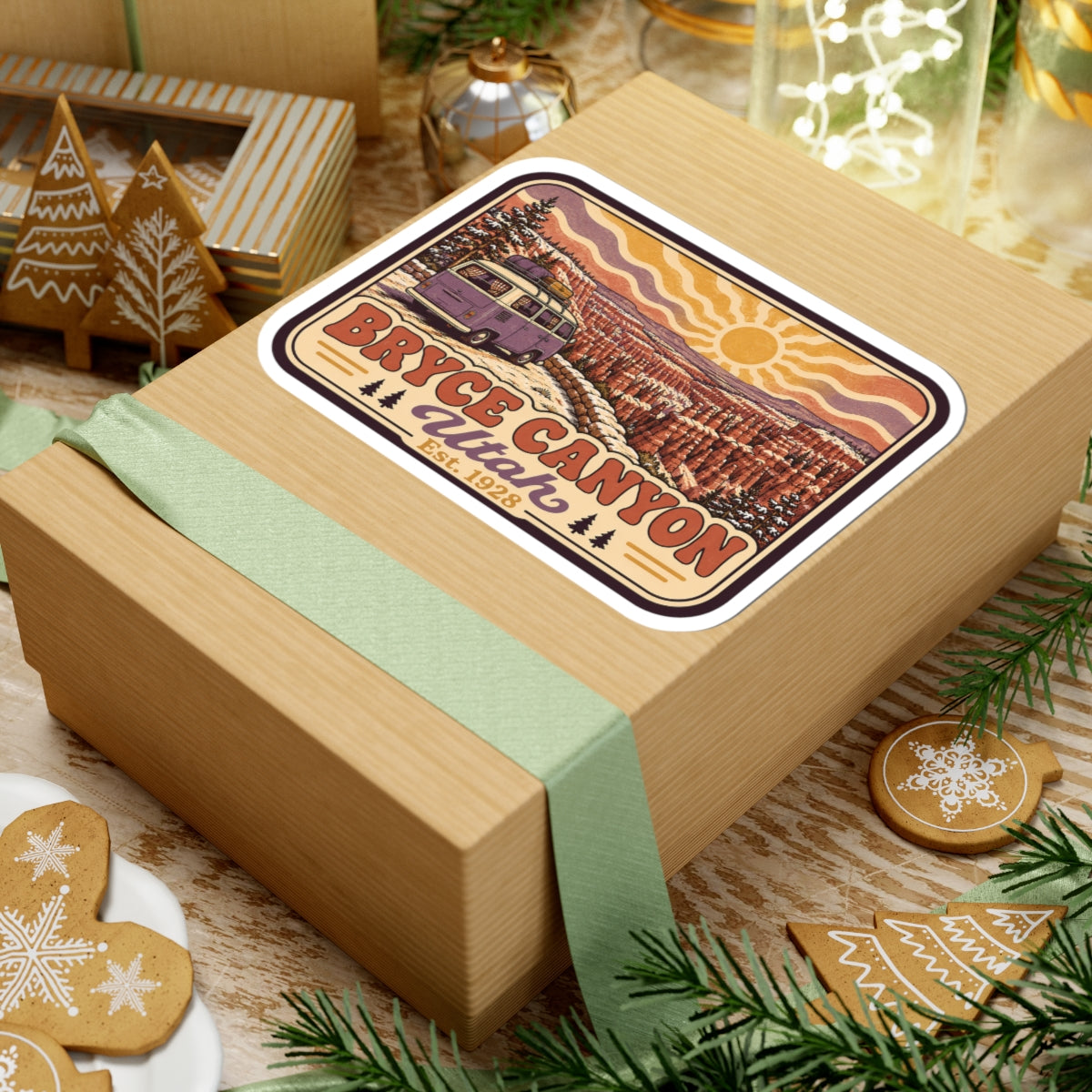 Kiss-cut Bryce Canyon Utah sticker on wrapped gift, showing camper van, sun, and canyon