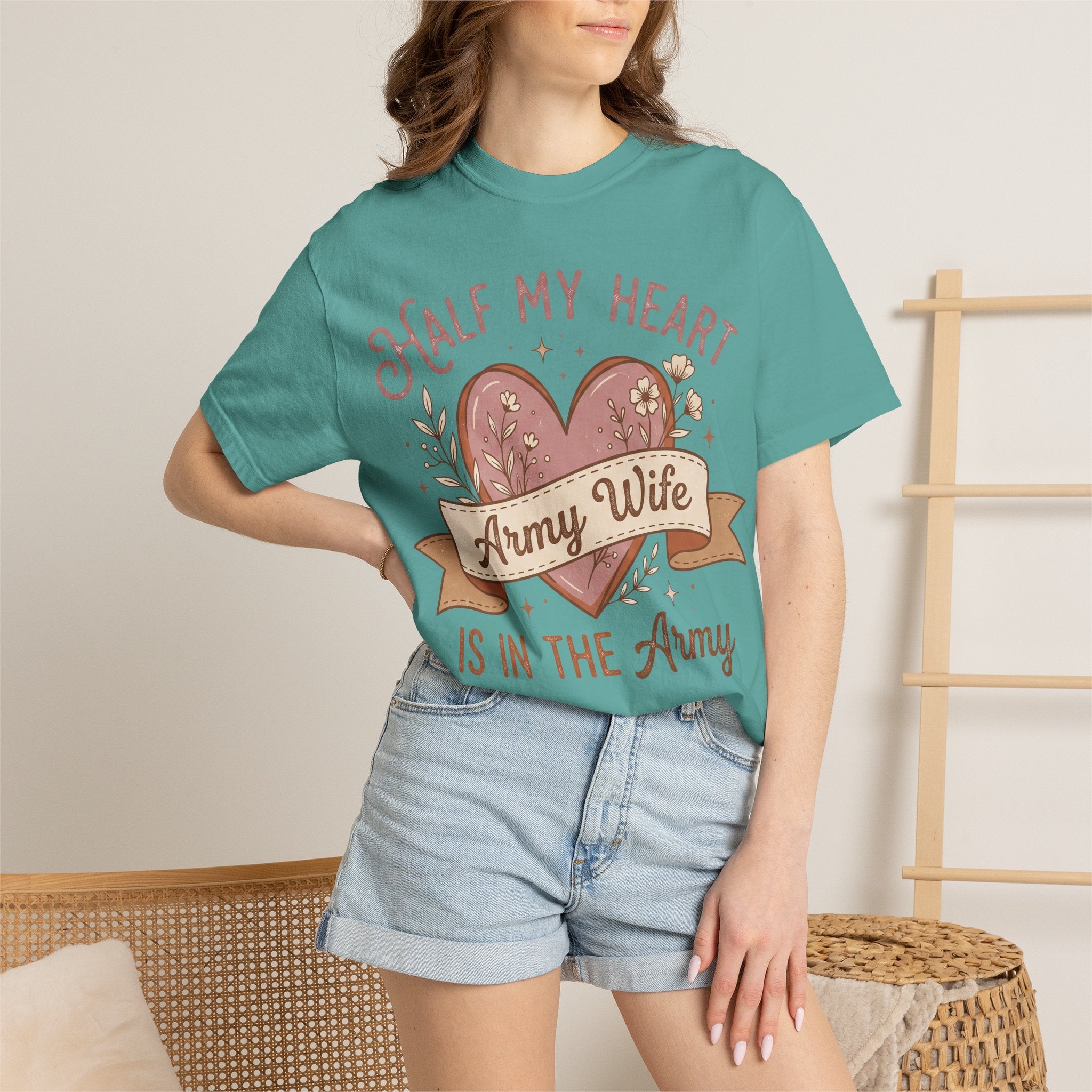 Teal T-shirt on model with heart graphic and 'Army Wife' and 'IS IN THE Army'
