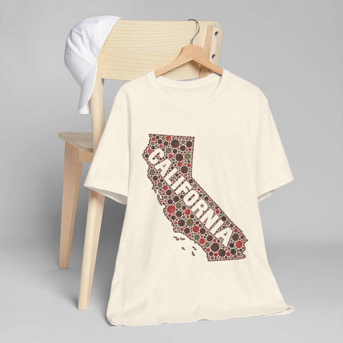 White crew-neck T-shirt with red floral dotted California outline graphic.