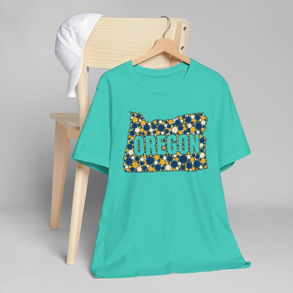 Teal crewneck t-shirt with Oregon graphic in blue and gold dots