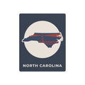 North Carolina metal art sign with state outline and nautical lighthouse graphic