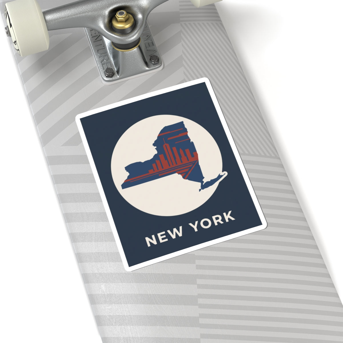 New York skyline sticker close-up: blue border, red skyline state silhouette, “NEW YORK”