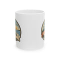 White ceramic coffee mug with side travel badge graphic, no handle visible.