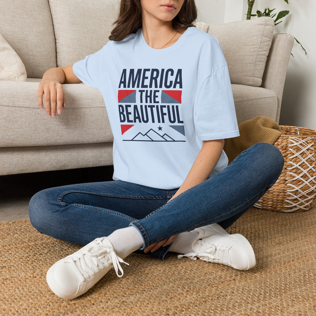 Light blue crewneck t-shirt with “AMERICA THE BEAUTIFUL” front graphic print.