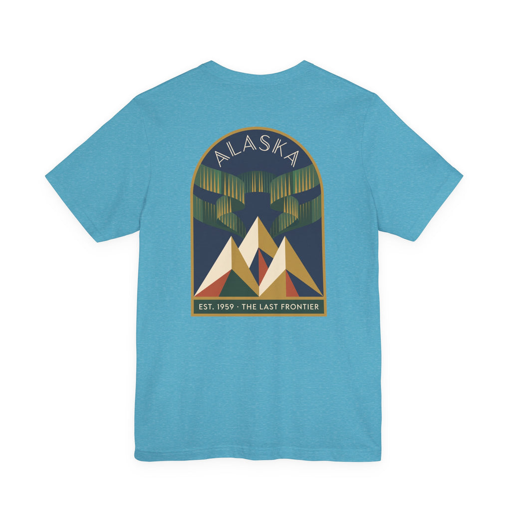 Light blue graphic T-shirt with Alaska aurora badge and mountain design