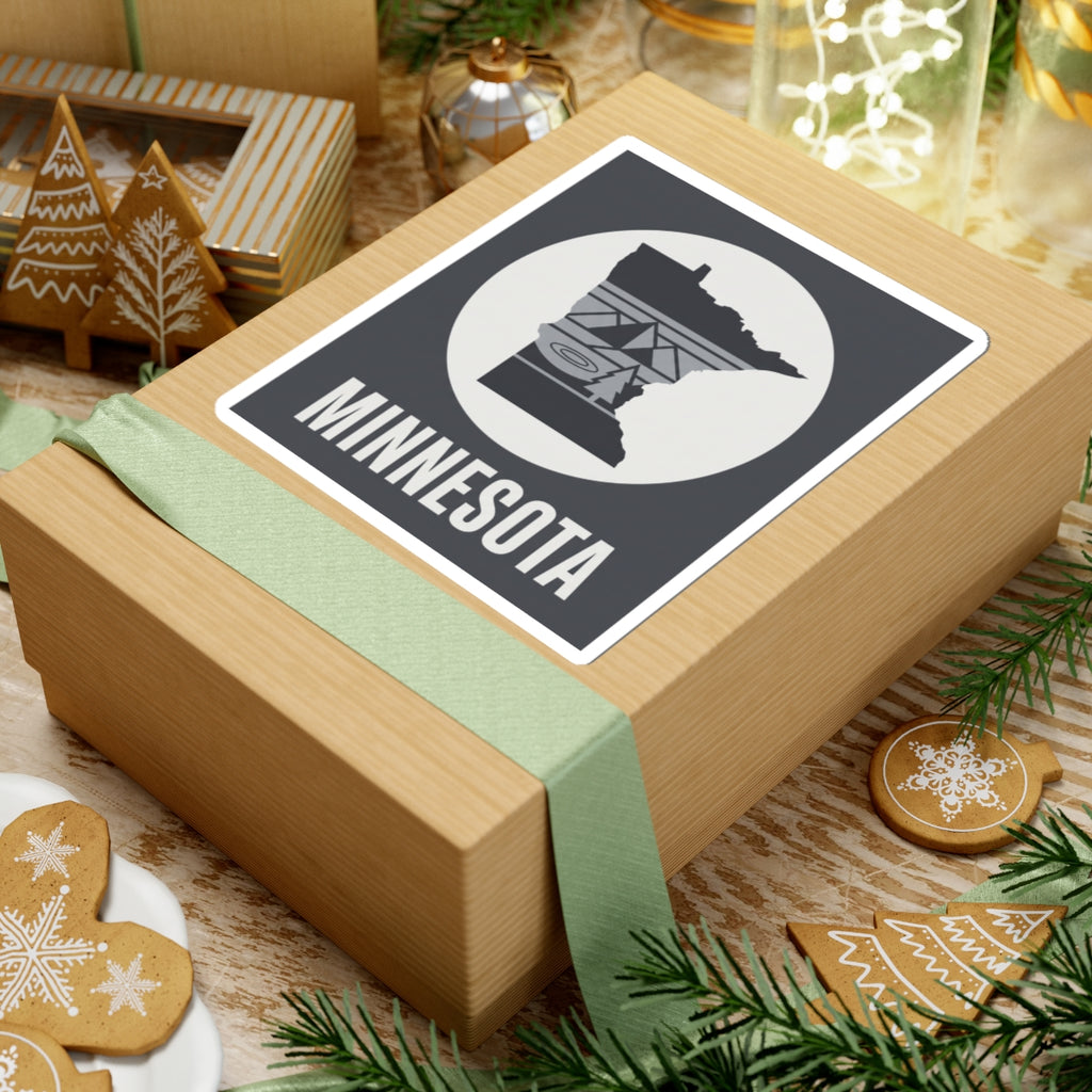 Minnesota state silhouette sticker on wrapped gift box with circular icon and “MINNESOTA”