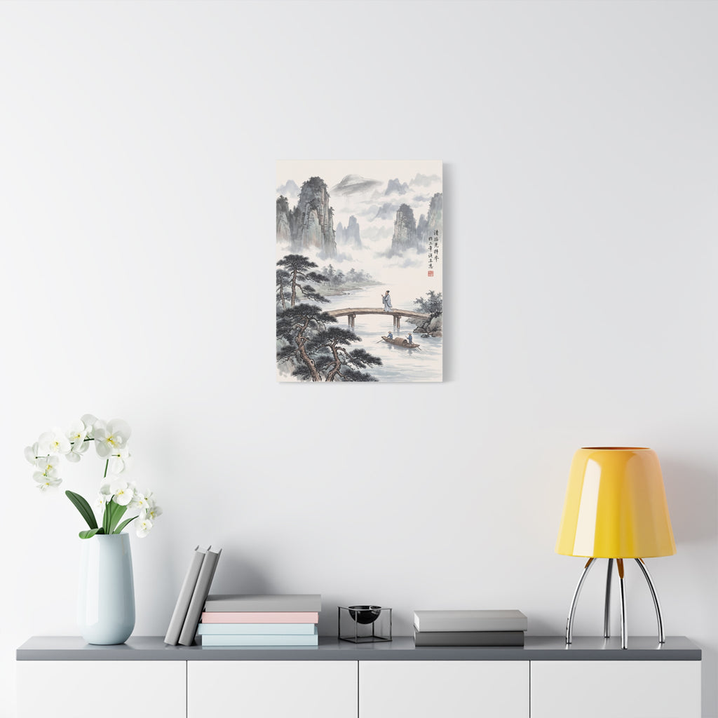 Small framed landscape wall art print on a white wall with misty peaks and river scene