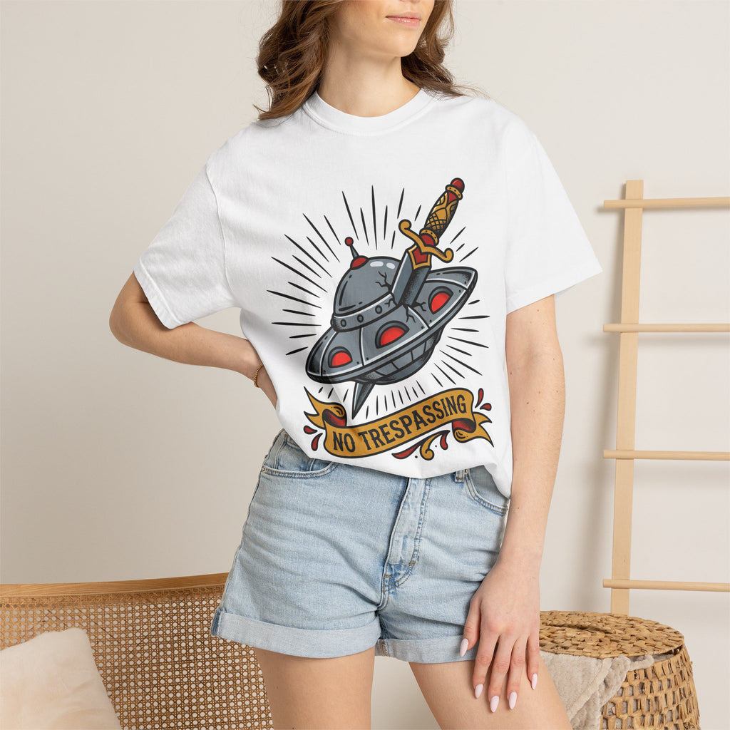 White T-shirt with cartoon UFO and dagger graphic and “No Trespassing” badge