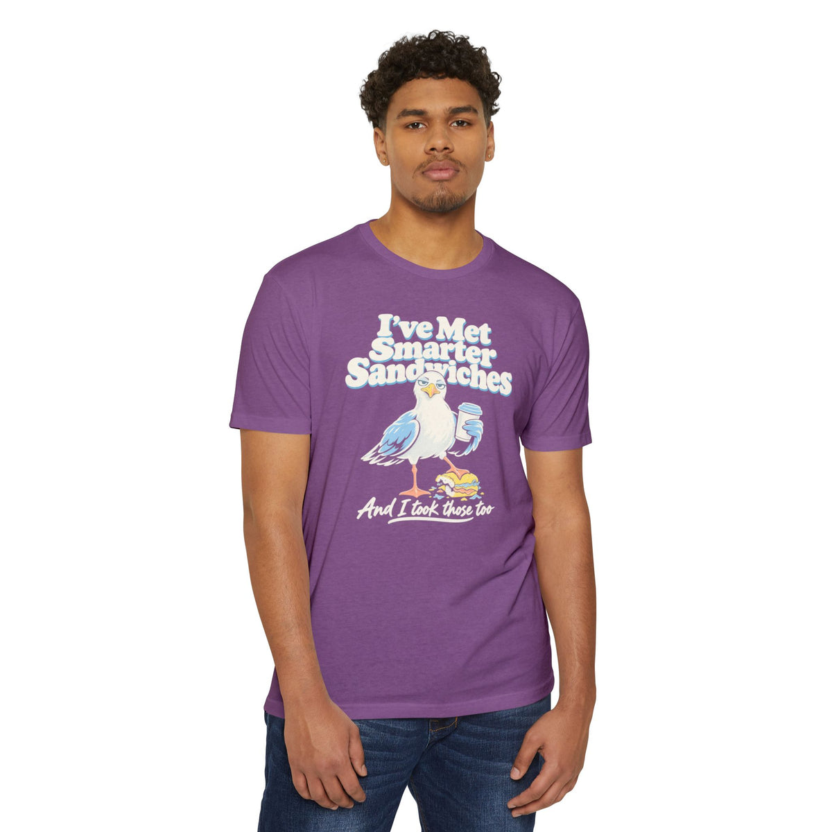Purple short-sleeve T-shirt worn by model, featuring seagull graphic and text front