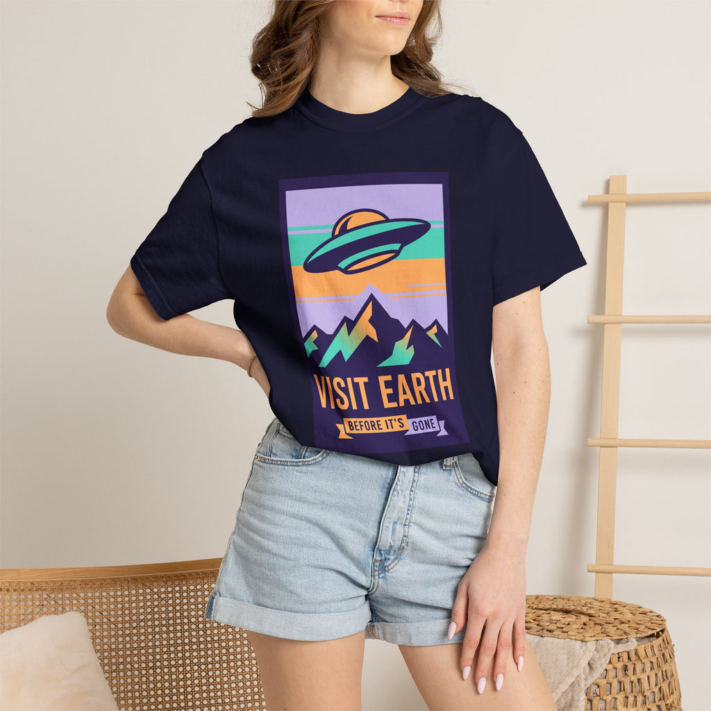 Dark navy crewneck T-shirt with retro UFO and “VISIT EARTH” graphic on chest
