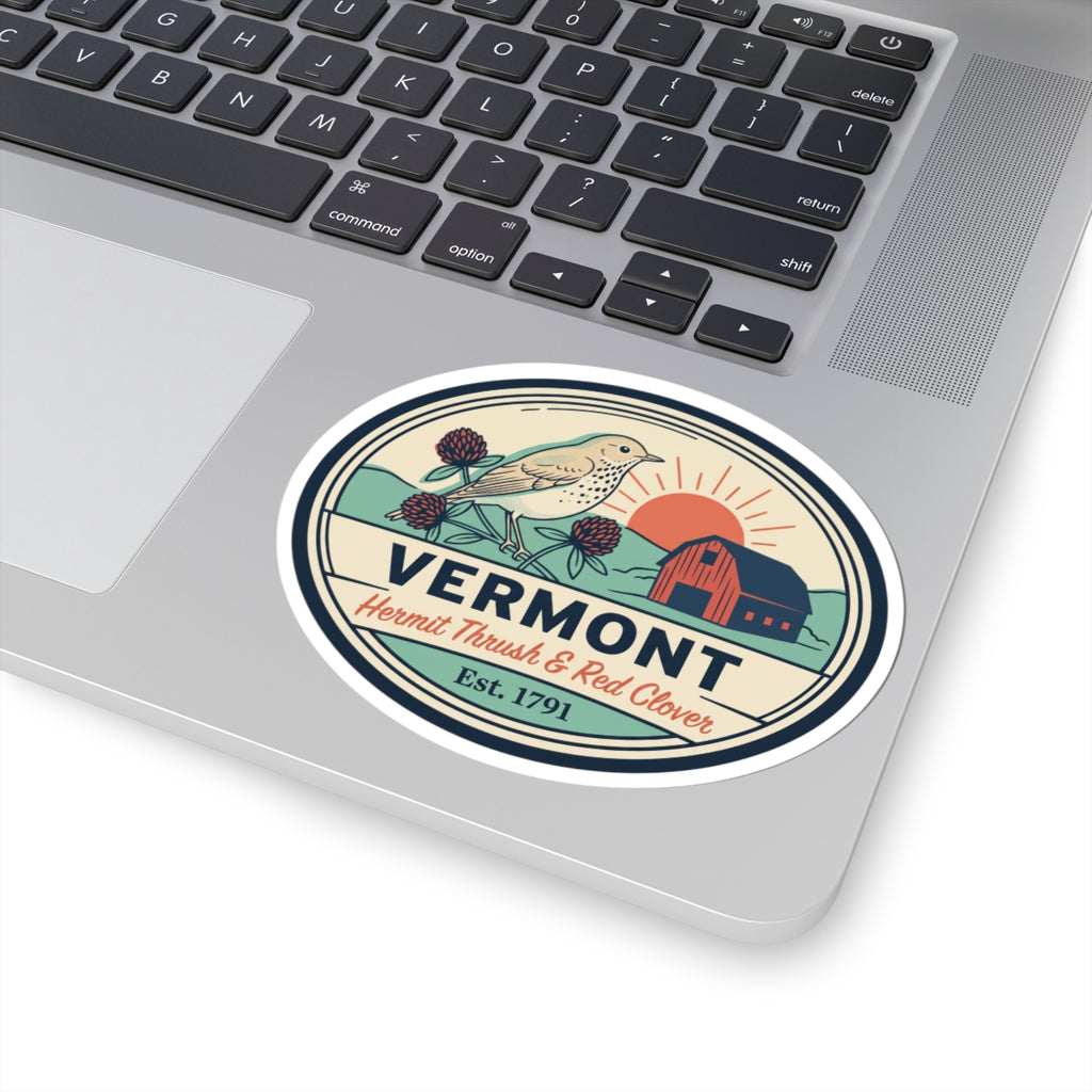 Vermont oval sticker with hermit thrush and red clover on laptop trackpad area