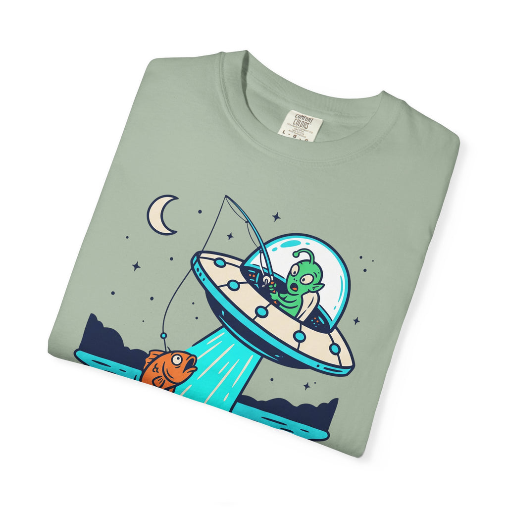 Sage green T-shirt with alien fishing UFO graphic and stars on the front.