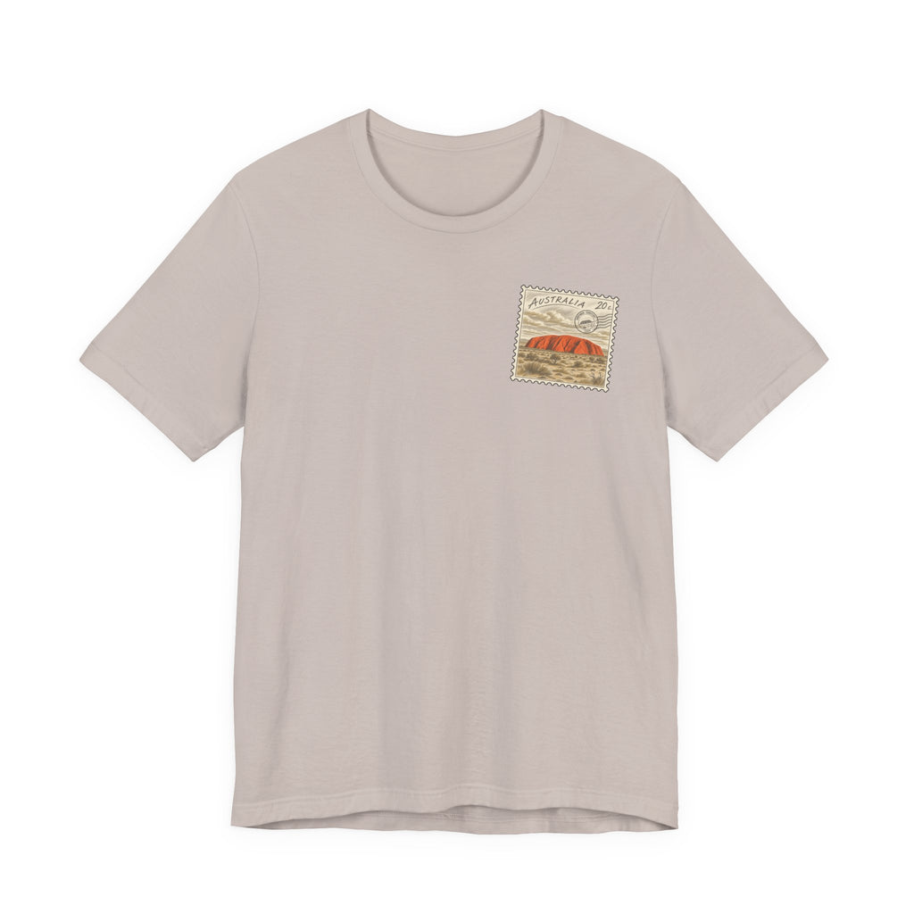 Light beige t-shirt with small vintage postage-stamp style graphic on the chest