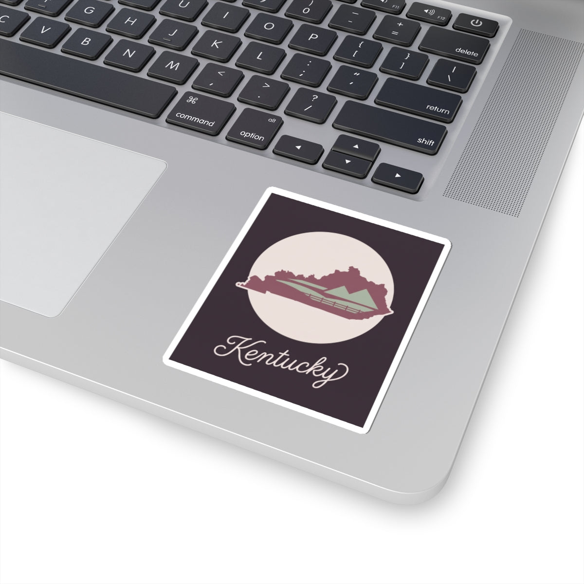 Kentucky silhouette vinyl sticker with white border, mauve state map, and cursive Kentucky script