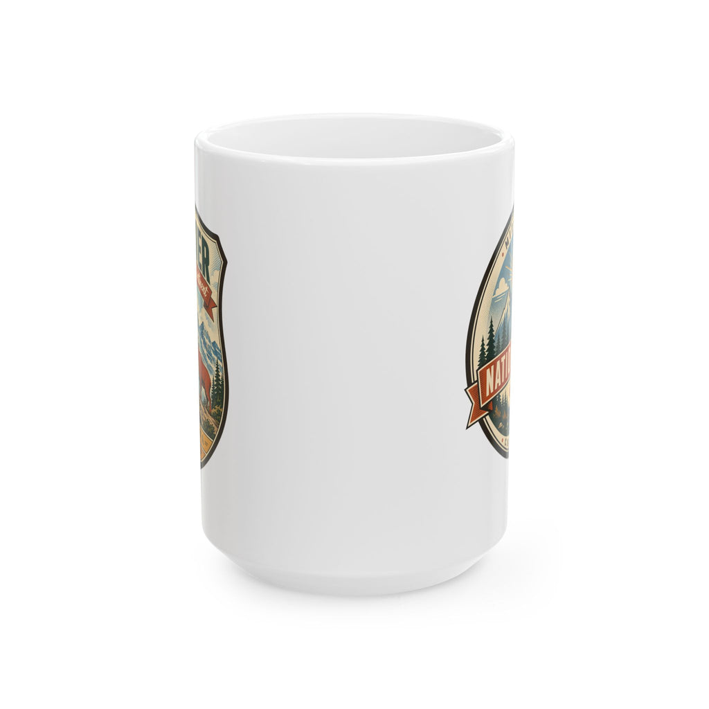 White ceramic mug with partial Glacier badge featuring mountains and bear graphic