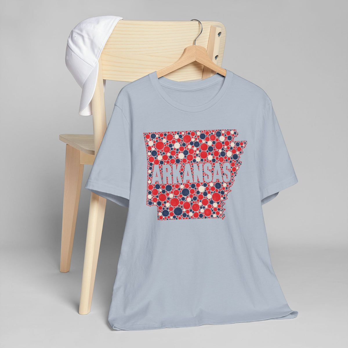 Light blue crewneck t-shirt with red, blue, white Arkansas graphic on chest