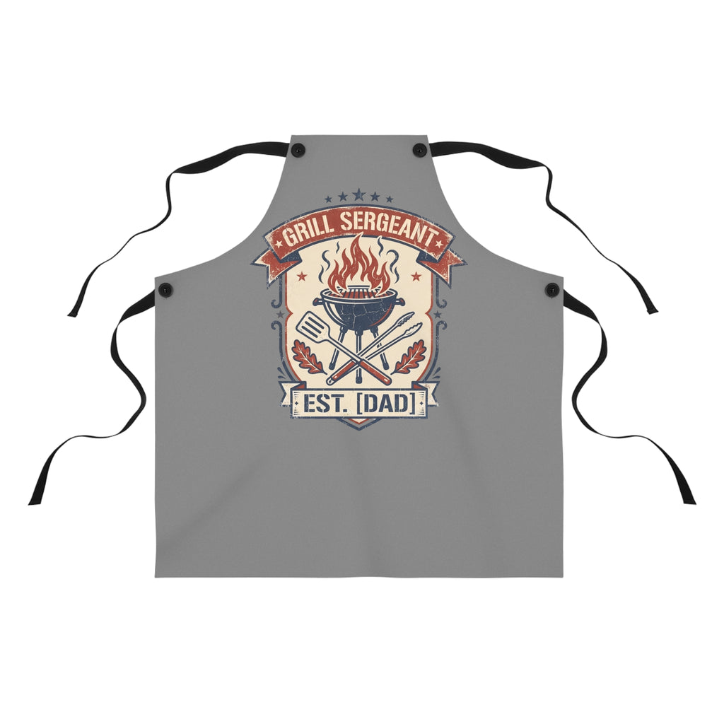 Gray BBQ apron with black neck ties and retro badge graphic