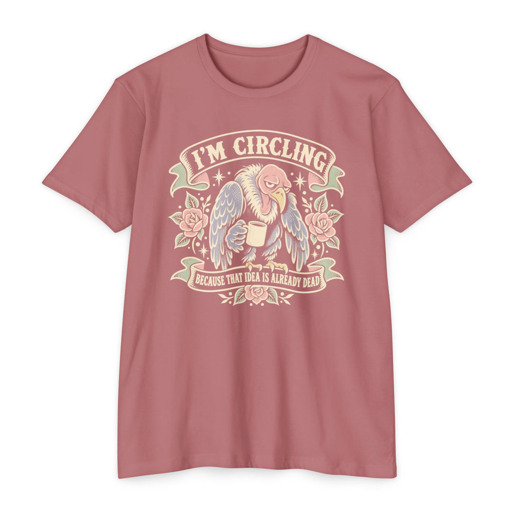 Pink graphic t-shirt with angel/vulture illustration and 'I'm circling' text