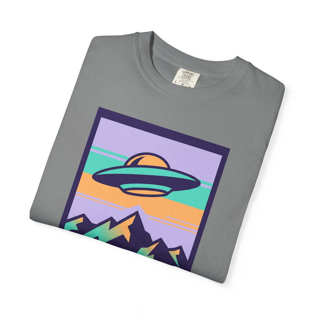 Dark gray T-shirt angled with UFO and mountains poster graphic on front