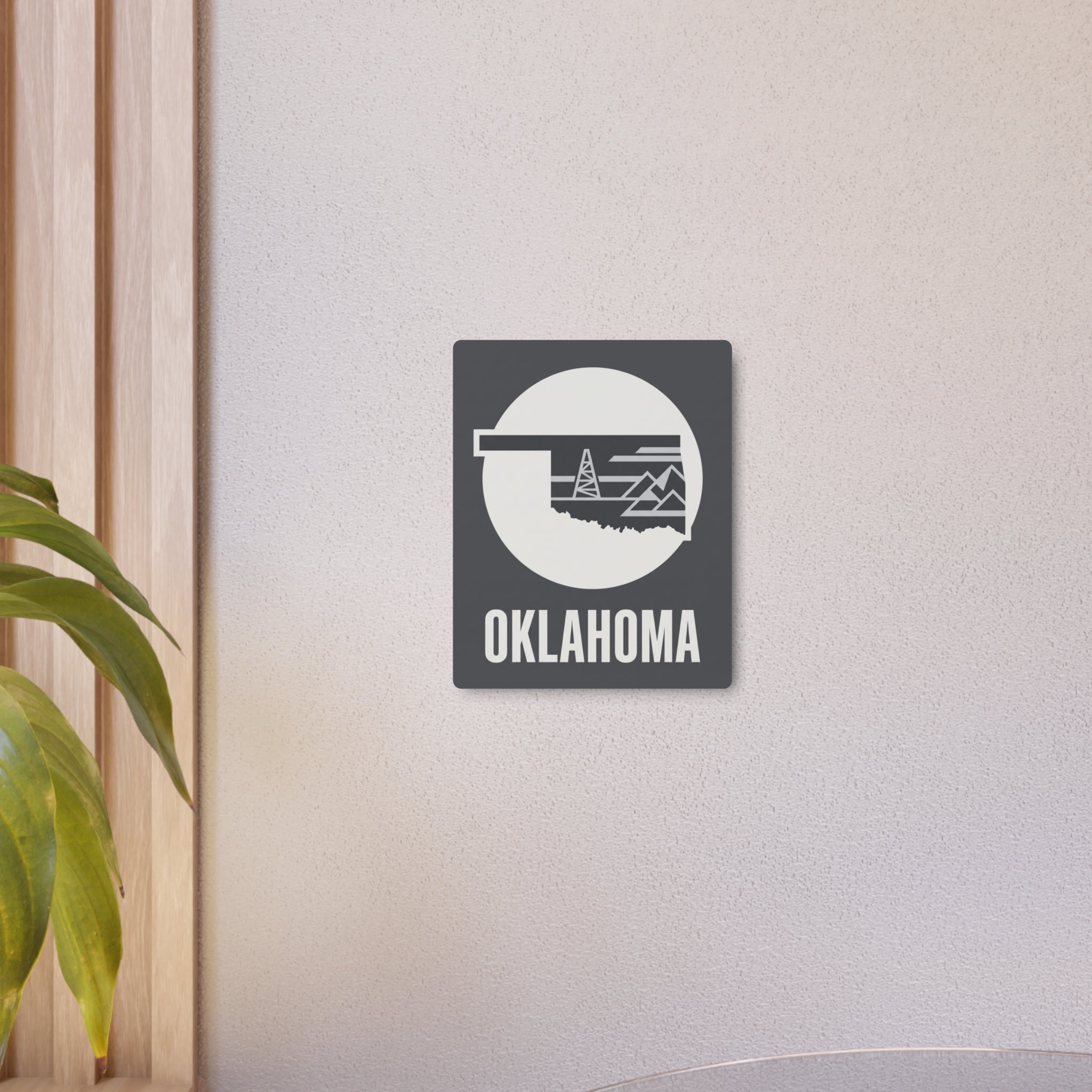 Oklahoma wall metal art sign displaying white circle oil rig graphic and OKLAHOMA