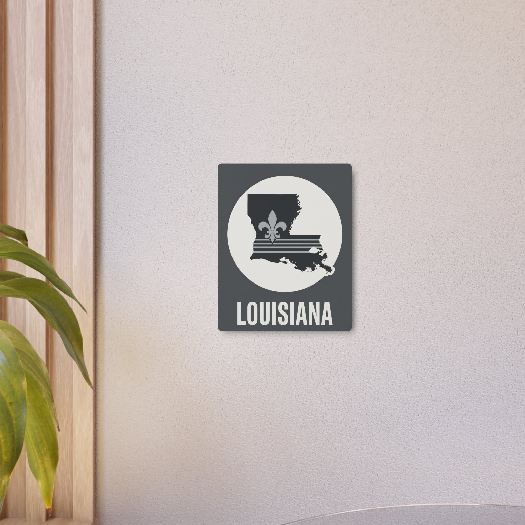 Louisiana metal art sign featuring white circle with state fleur-de-lis and “LOUISIANA”