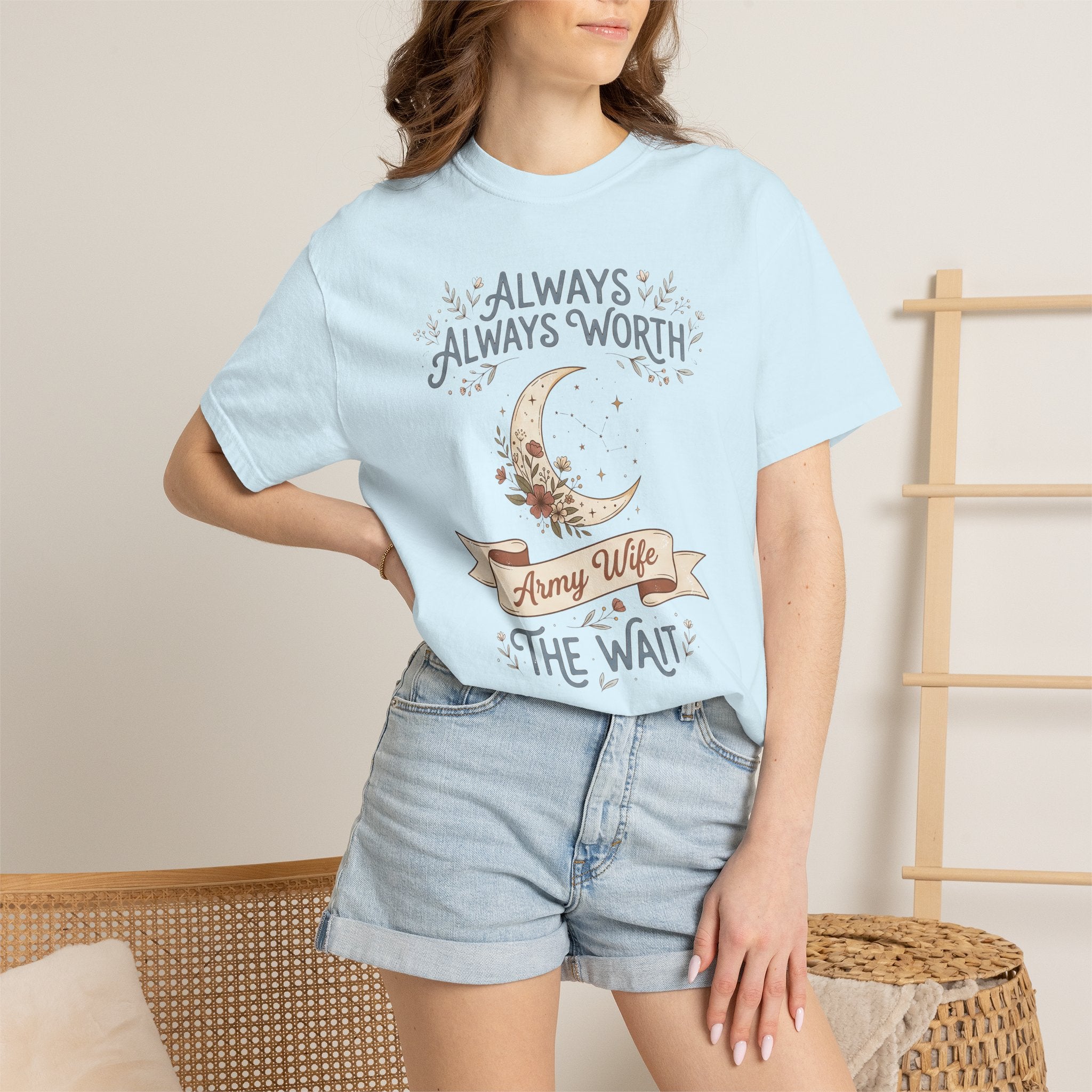 Light blue T-shirt on model with crescent moon and “ALWAYS WORTH” design